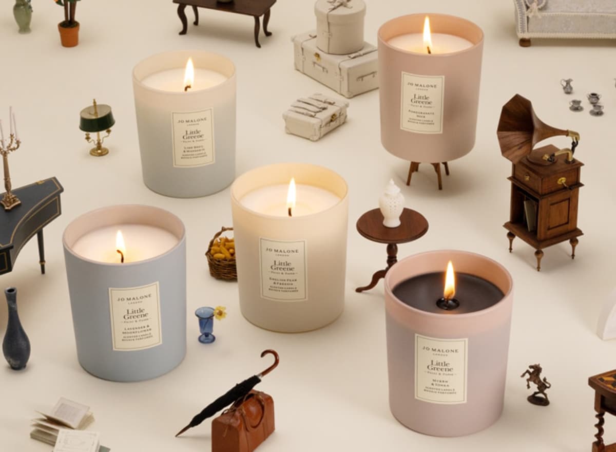 Jo Malone London Diffuser on wooden table with flowers in a vase