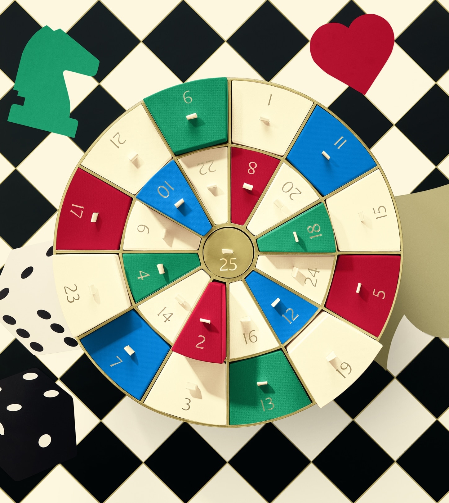 Colourful advent calendar dartboard box on checkerboard playing card and dice background, teasing pre-launch collection.
