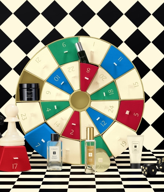 Jo Malone London Christmas Advent Calendar 25 doors and products standing in front