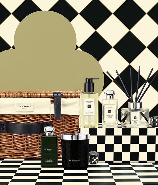 Jo Malone London Christmas Favourites Hamper with products and checkered background