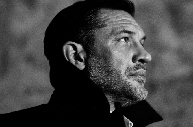 A side portrait of Tom Hardy in black and white, and Jo Malone London Cypress & Grapevine Cologne Intense bottle 