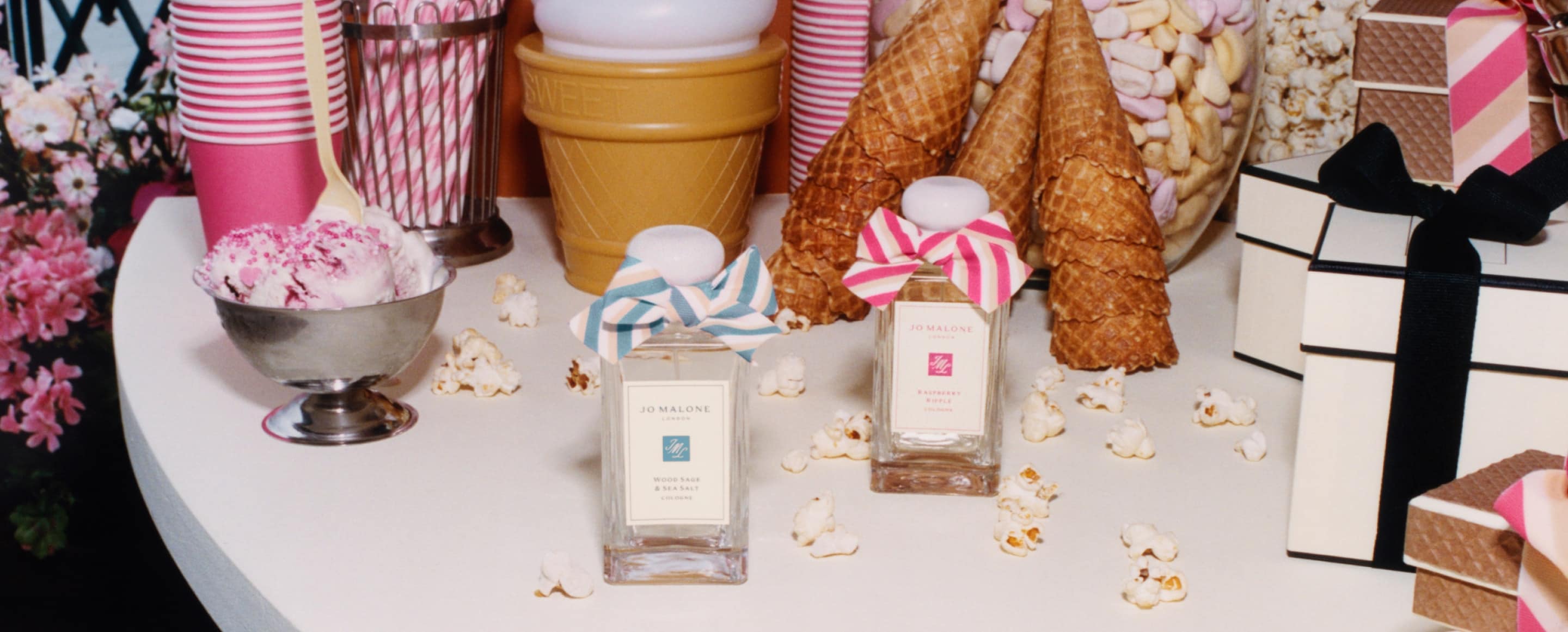 A stop motion video shows a seaside scene with a seagull on a deckchair next to a cologne and blue and white beach accessories. 