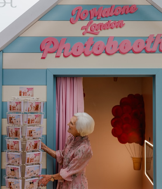 Jo Malone London Pop Up with Mary Berry looking at seaside postcards
