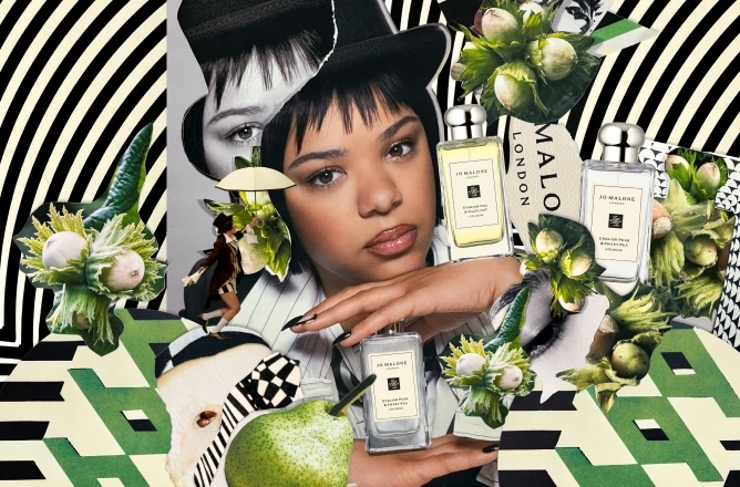 Person with Jo Malone London bottles, pears, and flowers on a black-and-white striped background.