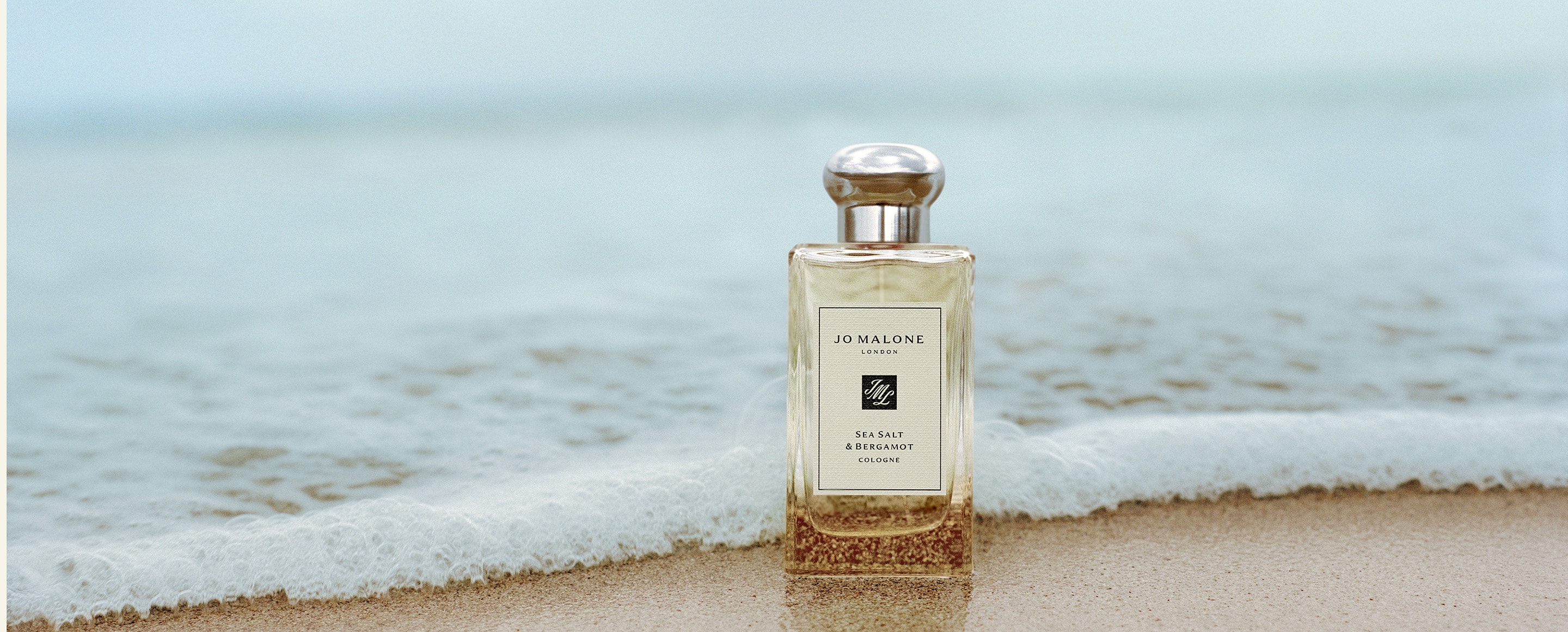 Jo Malone London Sea Salt and bergamot Cologne on a beach 
