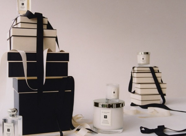 Jo Malone candle, cologne and gift boxes on a table