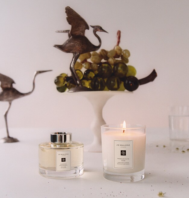 Jo Malone London Lime Basil Mandarin Diffuser and Pomegranate Noir Home Candle with birds and ornamnets