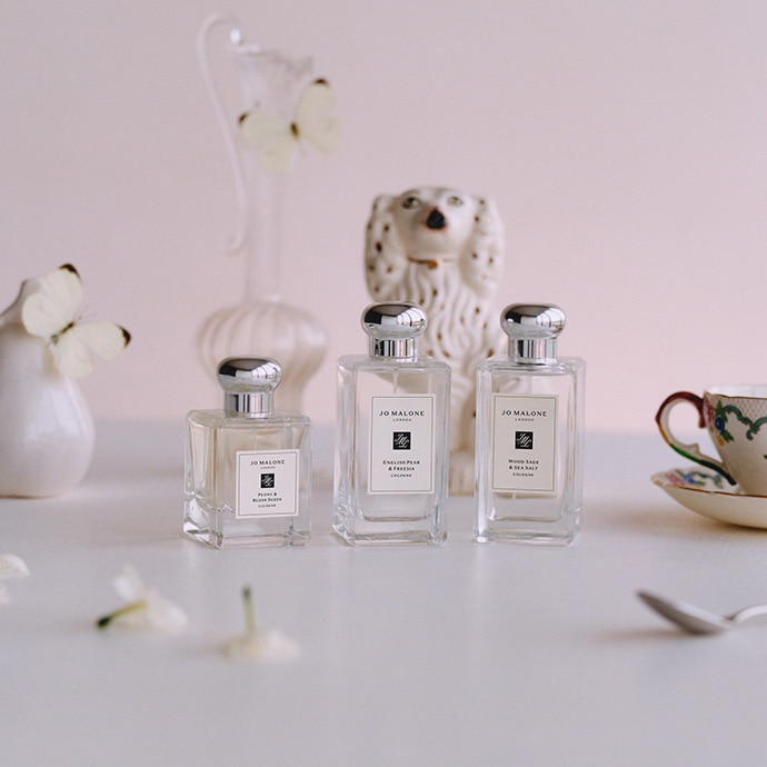Selection of bestselling Jo Malone colognes placed next to decorative porcelain