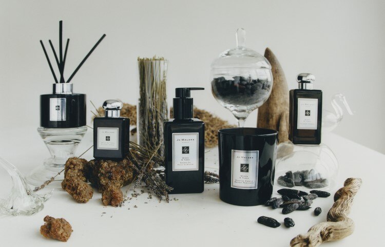image of the full myrrh & tonka range in cologne, bath & body and home surrounded by lavender 