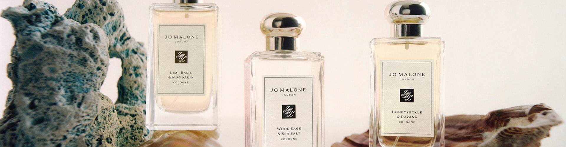 Three Jo Malone London colognes surrounded by flowers chicks and eggs