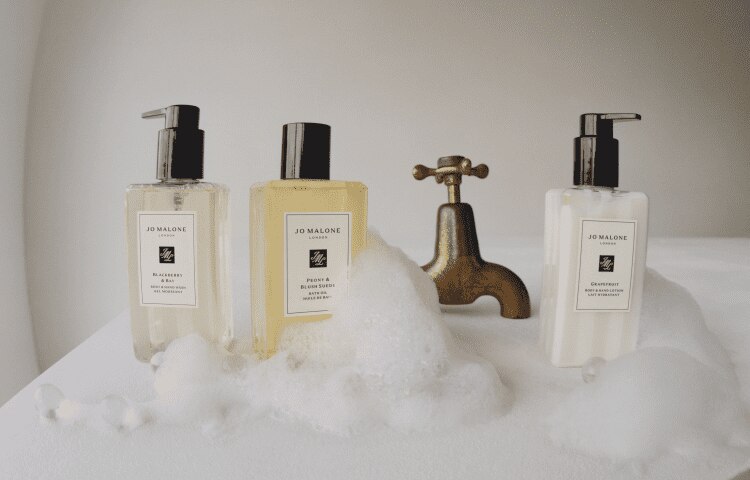 Image of three luxury bath and body products. Two are body & hand washes in mixed fragrances and a body lotion in grapefruit