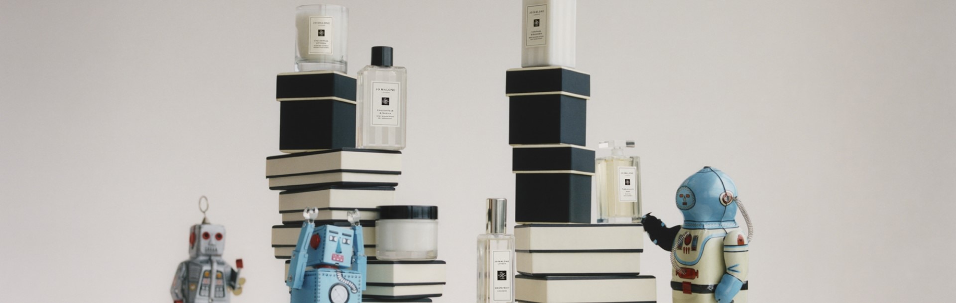 stack of jo malone london cream and black boxes deluxe samples. 9ml colognes, 15ml Body Washes & Body cremes.