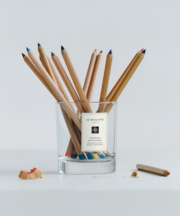 Jo malone london lime basil and mandarin empty home candle filled with coloured pencils