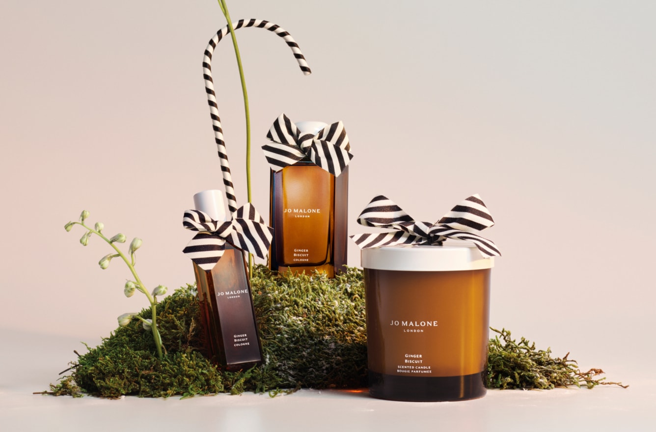 Jo Malone London Ginger Biscuit Collection Candle Cologne on bed of moss with black and white bows